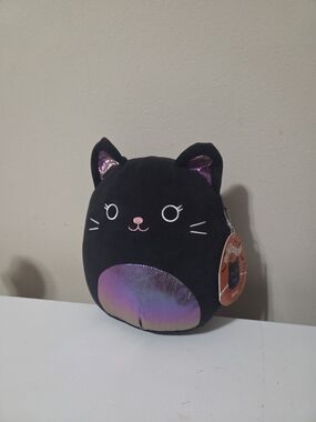 Kyra the Cat is a black and iridescent Squishmallow from the Halloween Squad 8in